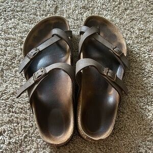 One toe Birkenstocks! Brown straps.